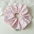 Close-up detail of pink floral cotton scrunchie with soft fabric texture and side label - Pink Small Flower Scrunchie