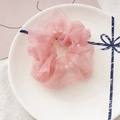 Detail of pink organza scrunchie featuring white pearls on a decorative white plate - Pearlescent Pink