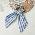 Detailed view of blue and white striped fabric hair scrunchie with long ribbon bow - Blue And White Striped