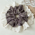 Close-up of vintage floral scrunchie with detailed white lace edge on a rustic background - Floral Style / Coffee Lace Hollow