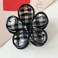 Detail of flower hair claw clip with black and white checkered pattern and glossy finish - Black Plaid Claw Clip