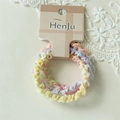 Detailed macro view of four pastel macaron colored lace elastic hair ties on a display card - Triangle Set (FS) / Multicolor