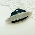 Detailed close-up of marble acetate hair clip with Amy Bear logo on a display card - Mixed Light Gray