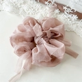 Close-up of elegant dusty rose chiffon scrunchie with streamer detail and soft texture - Dusty Pink