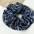 Detailed close-up of dark blue paisley print fabric on a large oversized hair scrunchie - Navy Blue