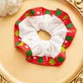 Detailed view of festive Christmas scrunchie with red tree print and white plush fabric - Christmas Tree Print White Edge