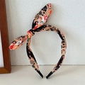 Detail van Halloween konijnenoor hoofdband met prints van pompoen, spook en kat - Light Orange Skeleton