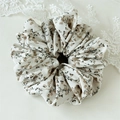 Close-up of floral scrunchie in beige chiffon with vintage brown flower pattern - White Floral Style A