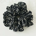 Close-up of black floral scrunchie with white patterns on lightweight chiffon fabric - Black Floral Style A