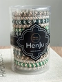 Elastic ponytail hair bands in various colors stored in a transparent plastic cylinder - Spring Spirit