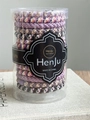 Close-up of durable elastic hair band set in a clear cylindrical storage container - Elegant Wisteria
