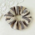Detail of grey and off-white striped knitted scrunchie with soft wool texture - Grey Stripe