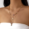 Goudkleurige gelaagde ketting met kleurrijke kristallen kruisjes en kralen - Goud