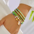 Λεπτομέρεια από boho πολυεπίπεδο σετ βραχιόλι με κοχύλι κρεμαστό στον καρπό - Πράσινο