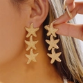 Chic triple starfish drop earrings in gold finish with textured metallic surface - Gold