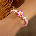 Detail of summer style handmade beaded bracelet with pink plumeria and starfish charms - Polymer Clay Flower (Pink)