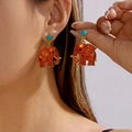 Ethnic style orange elephant earrings with turquoise stone studs in golden finish - Orange Elephant Style (ER26Y0065)