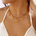 Collier double rang doré avec breloques étoile de mer et coquillage sur haut en crochet - Or