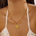 Gold-plated ocean shell necklace with starfish pendants and white pearl on model - Pink Shell Starfish Pearl Style (NC26Y0012)