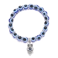 Detailed close-up of blue Evil Eye beaded bracelet featuring a silver owl charm pendant - Owl