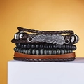 Detailed close-up of multilayer leather bracelets with silver feather charm and wooden beads - Brown Feather Pendant Style (#2)
