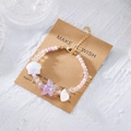 Perlen-Ozean-Charm-Armband mit Seestern und Muschel auf Display-Papierkarte - Lila Seestern (BR26Y0107-1)