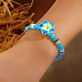Colorful plumeria flower beaded bracelet with blue crystal beads and rainbow spacers - Crystal Polymer Flower (Blue)
