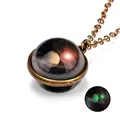 Close-up of vintage bronze galaxy necklace with luminous Saturn glass pendant glow effect - Saturn Pattern (#5)