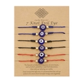 Set of 6 woven Evil Eye knot bracelets in red, black, and blue on display card - Multicolor Combo