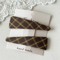 Detail of two handmade plaid fabric BB hair clips on a vintage decorative card - Yellow Green Plaid