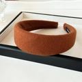 Detailed view of wide-brimmed caramel wool felt headband with thick plush texture - Caramel color
