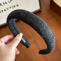 Detail of black wool headband texture showing soft winter fabric and high-quality craftsmanship - Black