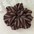 Detail of soft striped knit hair scrunchie with warm brown and beige texture - Brown