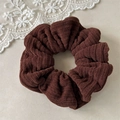 Detail shot of brown corduroy scrunchie showing ribbed texture and elastic band - Dark Brown