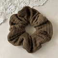 Detail view of coffee brown corduroy scrunchie showing thick ribbed velvet texture and folds - Khaki