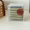 Set of 5 sage green satin scrunchies in transparent box with elegant silk texture finish - Green