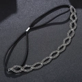 Detail of silver infinity bridal headband with sparkling rhinestones on black elastic band - Black