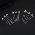 Detailed view of silver rhinestone hair pins set for elegant wedding hair styling - Rose Gold