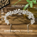 Elegant silver bridal headband with crystal flowers and leaves on wooden background - Silver