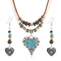 Detailed macro of turquoise heart pendant with leather cords and wooden beads - Heart Style (Style 3)
