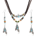 Close-up of bohemian set with wood beads, turquoise accents and silver feather pendants - Feather Style (Style 2)