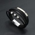 Detailed macro view of multilayer black woven leather bracelet with magnetic clasp - Black Leather + Silver Accessories