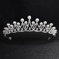 Elegant silver alloy tiara with sparkling rhinestones and white pearls on black background - Silver With Pearl