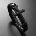 Detailed macro view of woven black leather bracelet with a textured metal cross charm - Black