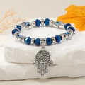 Pulsera Mano de Fátima con cuentas azules facetadas y dijes del Ojo Turco protector - Azul