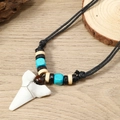 Bohemian tribal shark tooth pendant necklace with turquoise and wood beads on wood - Blue Series