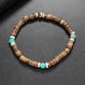 Bracelet extensible ethnique en disques de coco marron avec accents de turquoise ronde - Pierre en peau de serpent bleu clair