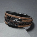 Detail of men's leather bracelet with infinity symbol and black metal magnetic clasp - Camel