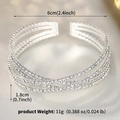 Vista macro del bracciale di strass argento con design incrociato e diametro 6 cm - Stile Argento (BS-J5578S)