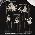 Detailed view of handmade bridal hair pins set with white petals, pearls and golden leaves - Gold (HS-J7283G)